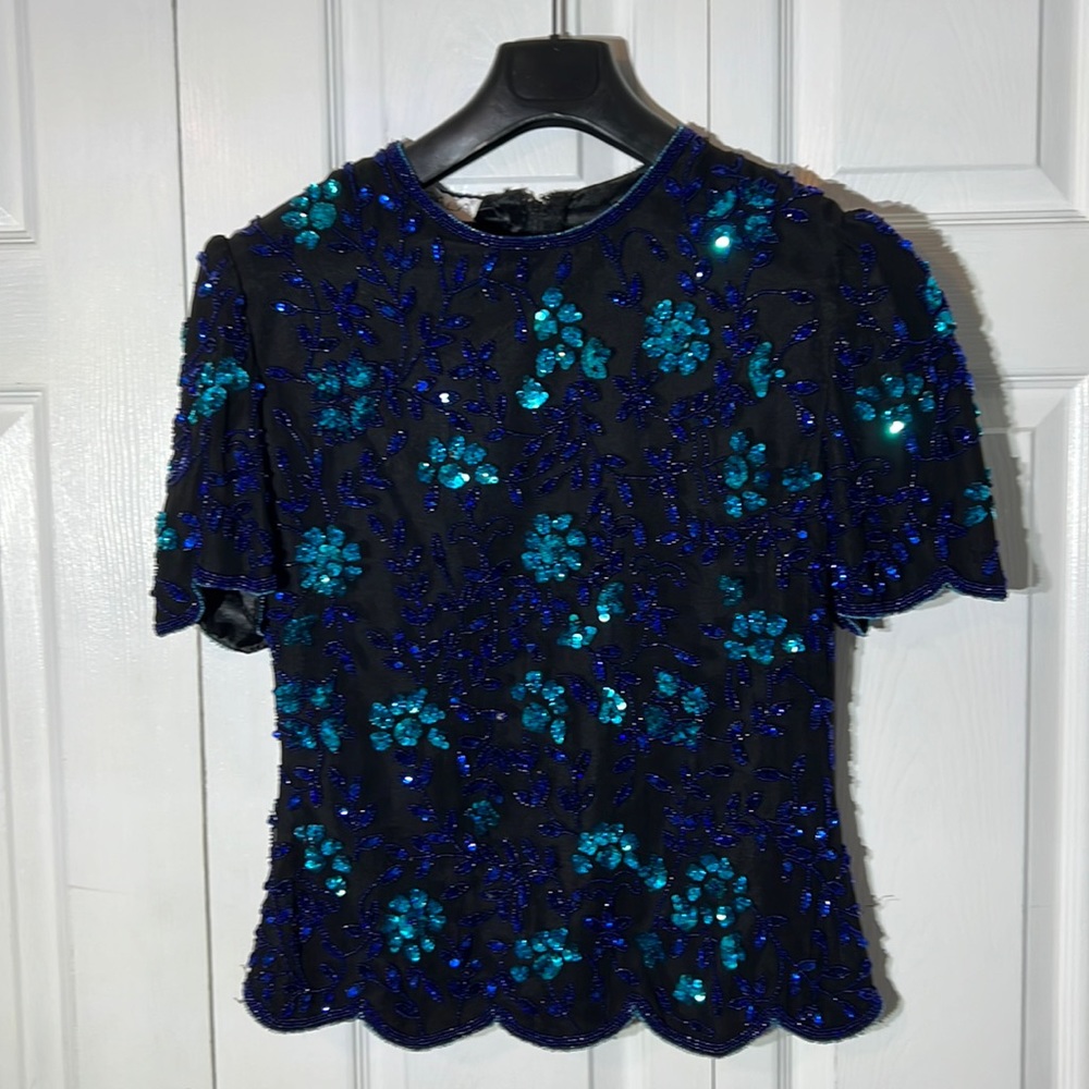 Black, Blue and turquoise sequins zip up top.